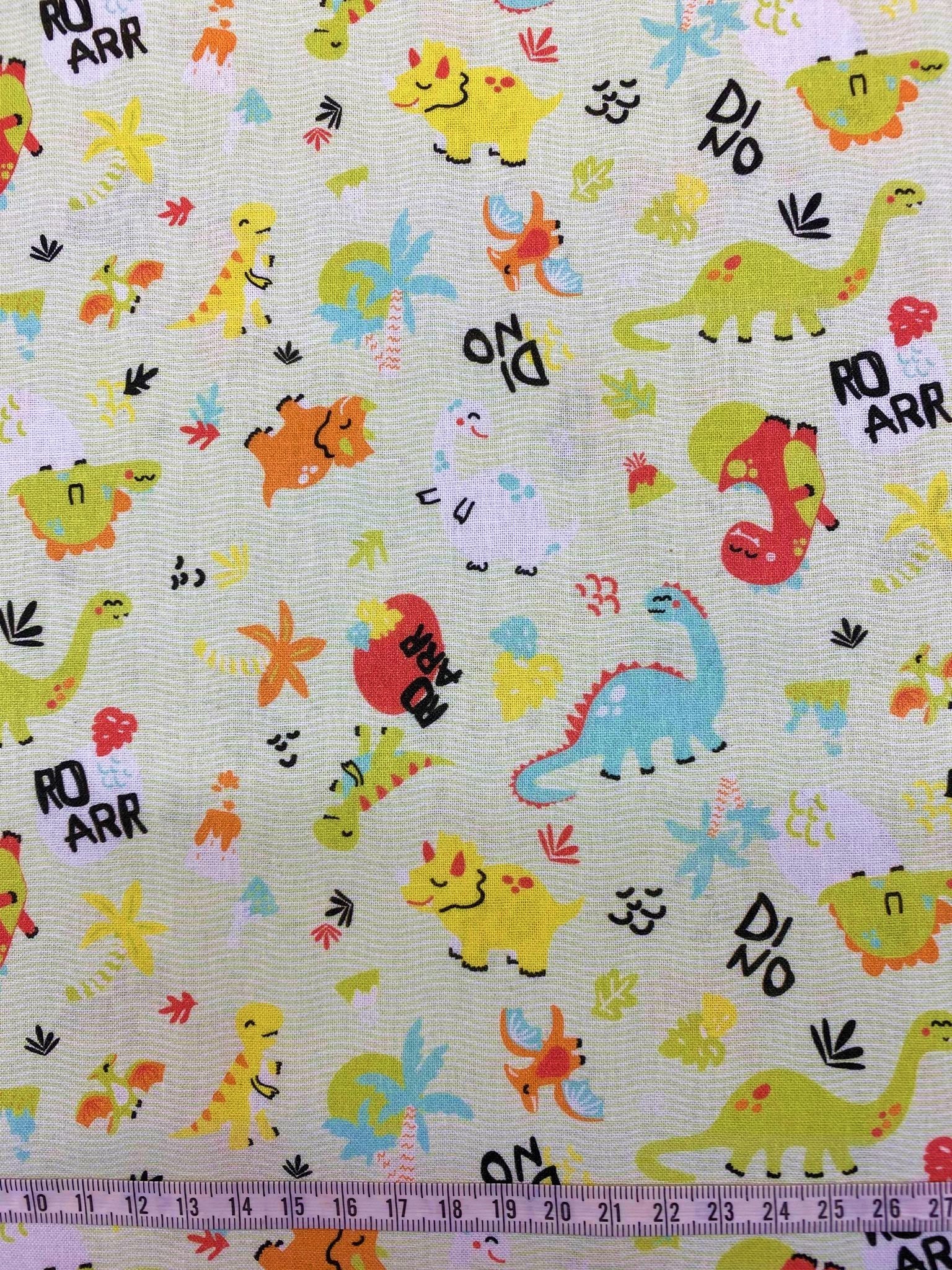 Coton 150 - Dinosaures fond vert amande