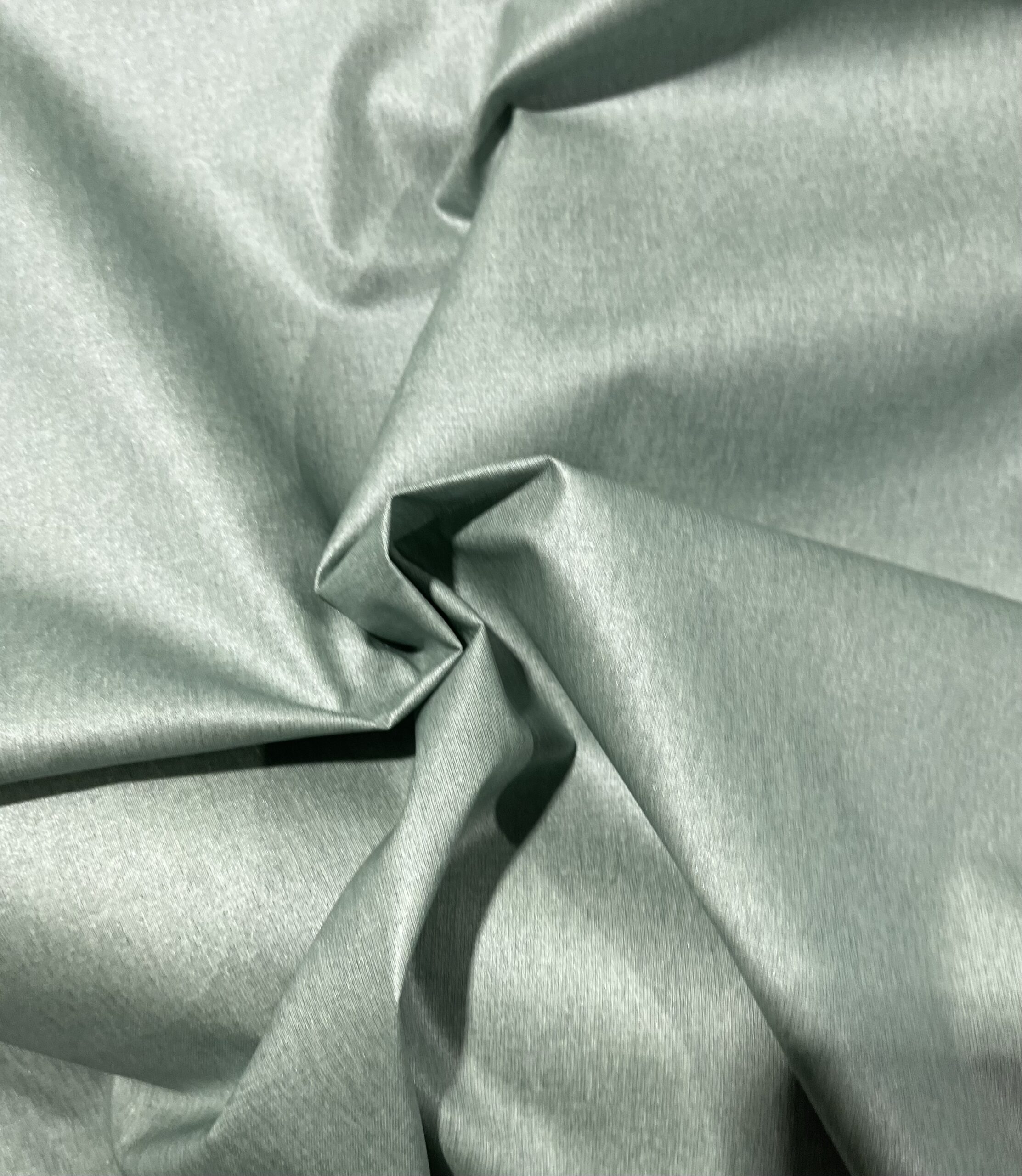 Coton enduit -Uni Vert d’eau  pailletée.